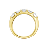 A side-profile view of a 14K yellow gold wide band ring, showing the tapered design and the five diamonds.