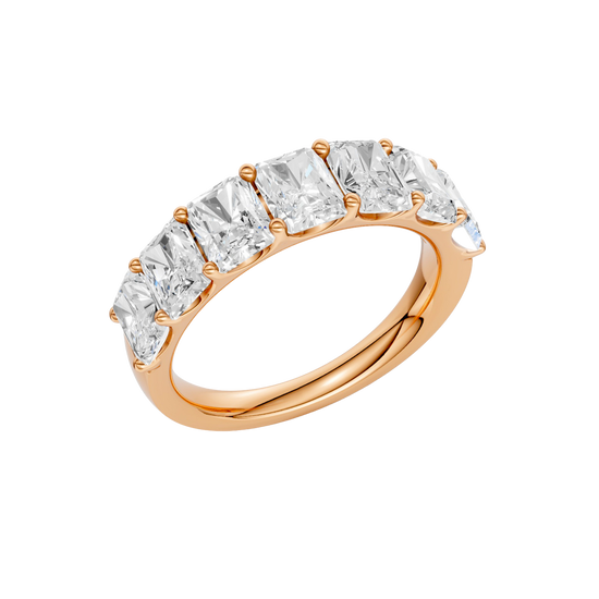 An angled view of a 14K rose gold wide band ring, showcasing the clean, bold lines of the emerald-cut diamonds.