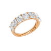 An angled view of a 14K rose gold wide band ring, showcasing the clean, bold lines of the emerald-cut diamonds.