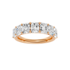 A top-down view of a 14K rose gold wide band ring with five horizontally-set emerald-cut diamonds.
