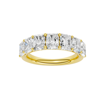 A top-down view of a 14K yellow gold wide band ring with five horizontally-set emerald-cut diamonds.
