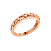 Angled view of the Fourteenth Collection geometric studded diamond stackable ring in polished rose gold, featuring star and geometric bezel-set round diamonds across a slim, high-shine band.