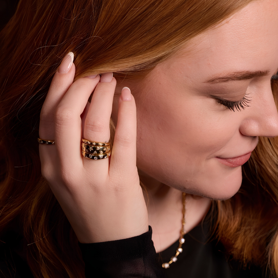A bold, high-polish 14k yellow gold statement ring by Amorati featuring scattered star and geometric insets with shimmering round-grown diamonds. Amorati’s signature F O U R T E E N T H Collection.