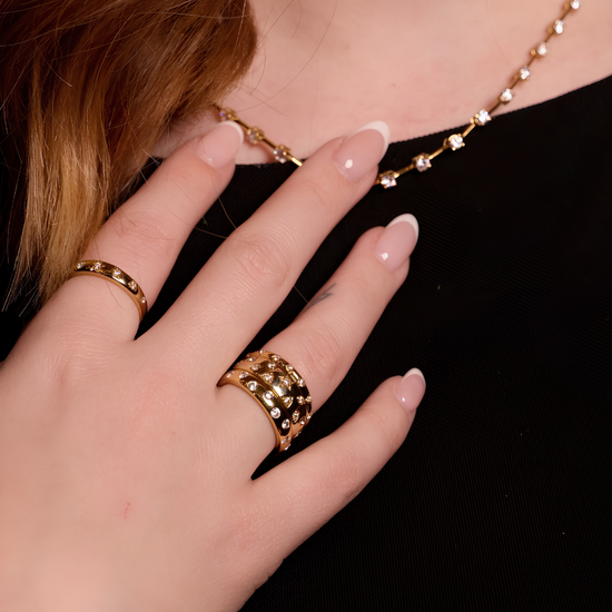 A bold, high-polish 14k yellow gold statement ring from the Amorati Fourteen Collection, featuring scattered star and geometric insets with shimmering round lab-grown diamonds.