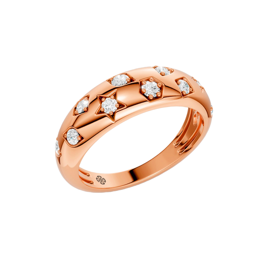 Angled view of the Fourteenth Collection star studded diamond ring in polished rose gold, featuring alternating star-shaped and geometric bezel-set round diamonds across a bold, high-shine band.