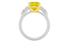 Side profile of the 4.16 cttw Soleil Cushion Canary Trilogy Diamond Engagement Ring showing the 14K White Gold setting and the precision-cut .66 cttw Trillion diamond side stones with a Cushion Cut Canary Yellow VS+ lab grown massive 3.5 ct diamond center stone that is IGI Certified and ships insured for free.