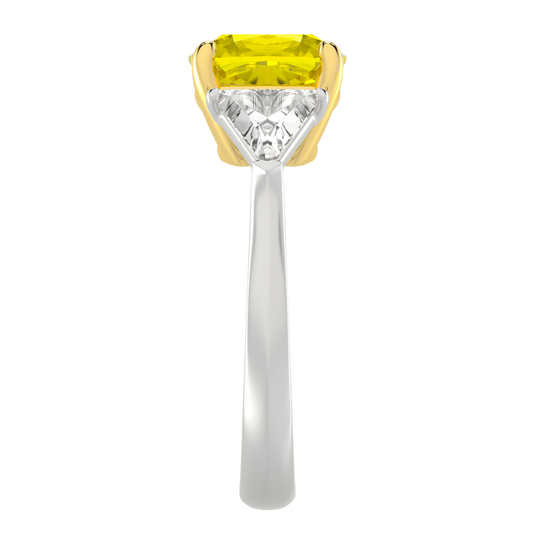 Side view of the Trilogy Engagement Ring which is highlighting the elevated brilliant 4.16 Cttw Soleil Cushion Canary Trilogy Diamond Ring with 3.50ct IGI Certified VS+ Vivid Center Yellow Canary Cushion Stone and an additional .66 cttw Trillion Side Stones