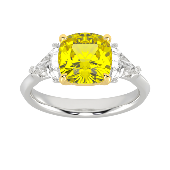 Top view of a white gold three-stone ring showcasing a gorgeous 4.16 Cttw Soleil Cushion Canary Lab-Grown Diamond that is a 3.50ct IGI Certified Center and Trillion Side Stones that are 0.33 ct weight each for a total of 0.66 cttw all stones are VS+ and E-F color set in 14 kt gold.