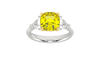 Top view of a white gold three-stone ring showcasing a gorgeous 4.16 Cttw Soleil Cushion Canary Lab-Grown Diamond that is a 3.50ct IGI Certified Center and Trillion Side Stones that are 0.33 ct weight each for a total of 0.66 cttw all stones are VS+ and E-F color set in 14 kt gold.