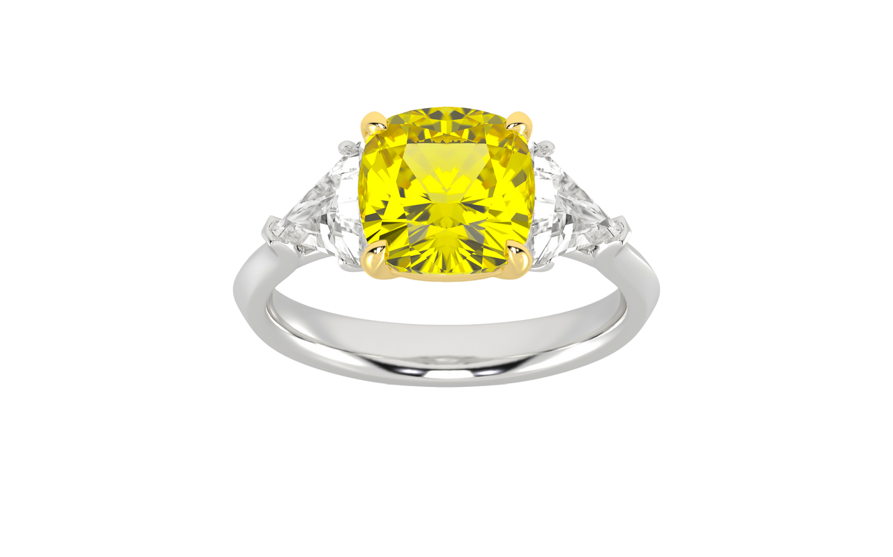Top view of a white gold three-stone ring showcasing a gorgeous 4.16 Cttw Soleil Cushion Canary Lab-Grown Diamond that is a 3.50ct IGI Certified Center and Trillion Side Stones that are 0.33 ct weight each for a total of 0.66 cttw all stones are VS+ and E-F color set in 14 kt gold.