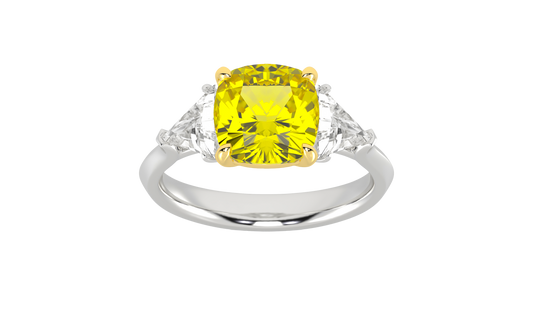 Top view of a white gold three-stone ring showcasing a gorgeous 4.16 Cttw Soleil Cushion Canary Lab-Grown Diamond that is a 3.50ct IGI Certified Center and Trillion Side Stones that are 0.33 ct weight each for a total of 0.66 cttw all stones are VS+ and E-F color set in 14 kt gold.
