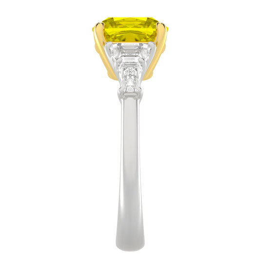 Side view of a white gold ring highlighting the elevated yellow diamond center and structured white diamond side stones.