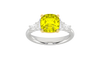 Top view of a white gold ring showcasing a yellow diamond center framed by white diamond side stones.