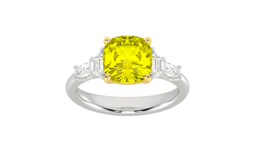 Top view of a white gold ring showcasing a yellow diamond center framed by white diamond side stones.