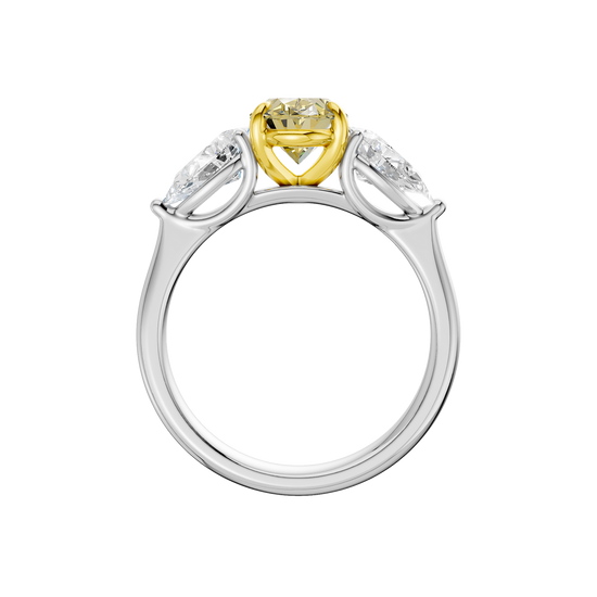 Front view of a white gold three-stone ring featuring a yellow diamond center flanked by pear-shaped white diamond side stones.