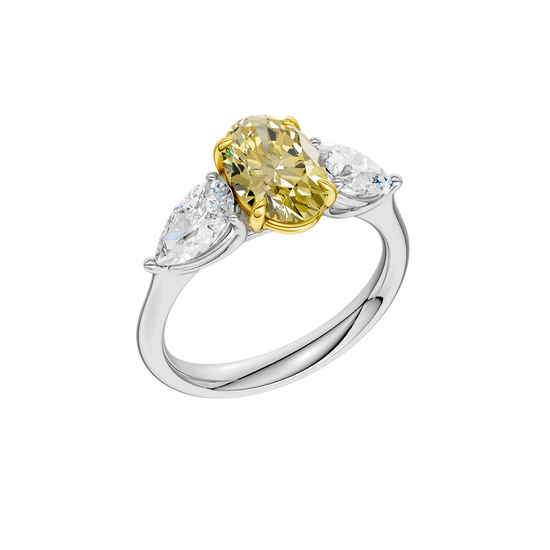 Angled view of a white gold three-stone ring featuring a yellow diamond center and pear-shaped white diamonds with a polished finish.