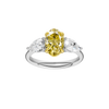 Top view of a white gold three-stone ring showcasing a yellow diamond center with pear-shaped white diamonds on each side.