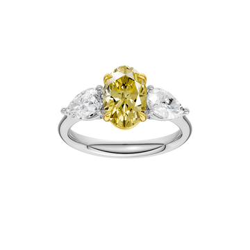 Top view of a white gold three-stone ring showcasing a yellow diamond center with pear-shaped white diamonds on each side.