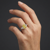 Lifestyle angled view of 4.66 Cttw Soleil Elongated Cushion Canary Yellow & White Trilogy Engagement Ring with IGI Certified 4.0ct  VS+ Vivid center lab grown diamond and .66 cttw of VS+ E-F diamond triangle side stones.