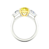 Close-up of the side view of the masterfully crafted 4.0ct IGI Certified VS+ Vivid Canary Yellow center lab grown diamond, highlighting the crushed-ice brilliance and VS+ clarity of both the center stone and the 0.66 cttw VS+ E-F side stones set in a pure 14 KT yellow and white gold setting that will hold these stones for a legacy heirloom piece.