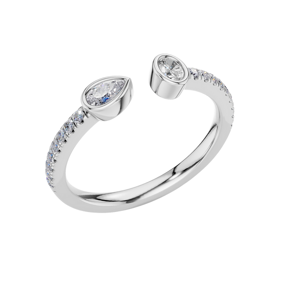 An angled view of a 14K white gold bypass ring, showcasing the pear-shaped diamond and the pavé band.