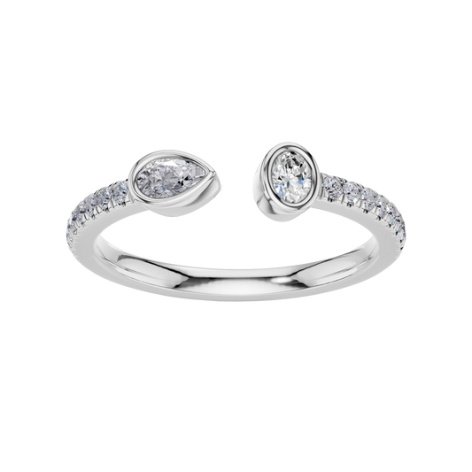 A top-down view of a 14K white gold bypass ring with a pear-shaped diamond on one side and a pavé diamond band on the other