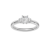 A top-down view of a 14K white gold ring with a central rectangular jewel and two smaller round gems on the sides.