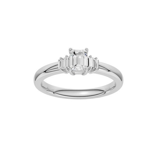 A top-down view of a 14K white gold ring with a central rectangular jewel and two smaller round gems on the sides.