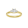 A top-down view of a 14K yellow gold ring with a central rectangular jewel and two smaller round gems on the sides.
