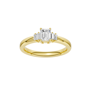 A top-down view of a 14K yellow gold ring with a central rectangular jewel and two smaller round gems on the sides.