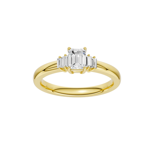 A top-down view of a 14K yellow gold ring with a central rectangular jewel and two smaller round gems on the sides.
