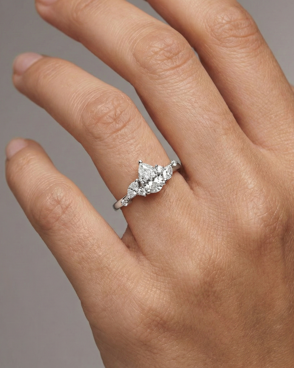 An angled view of a 14K yellow gold ring, showcasing the brilliant arrangement of the jewels on a finger.