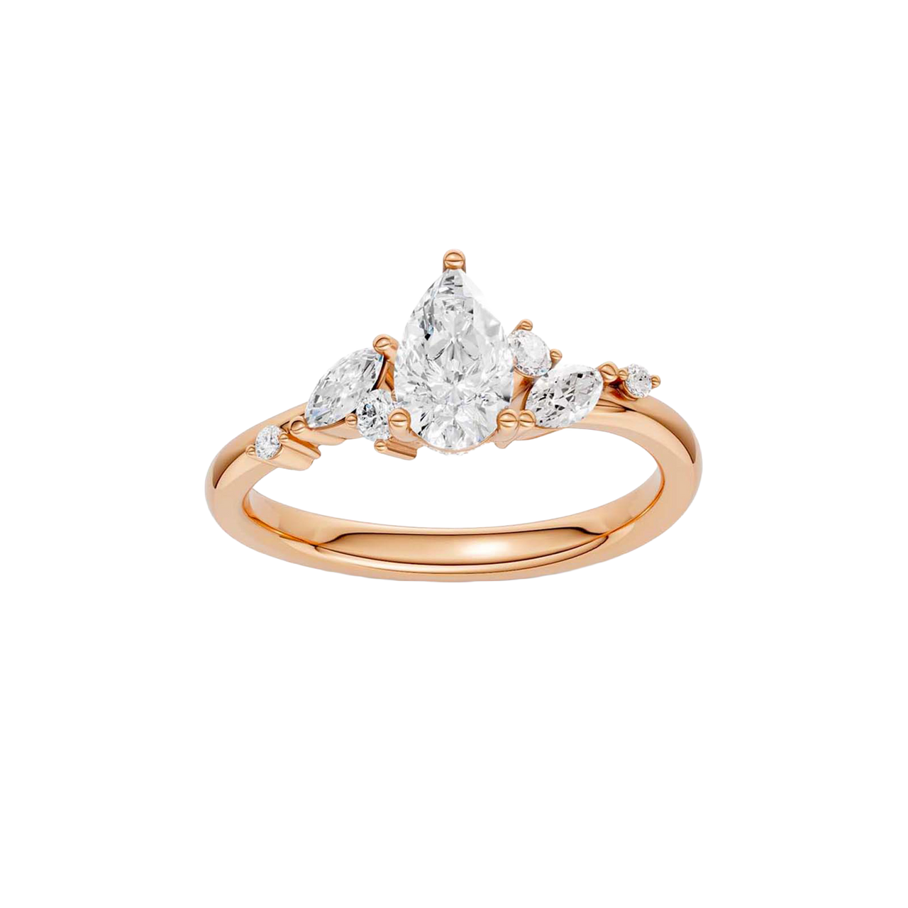 A top-down view of a 14K rose gold ring with a three-stone cluster of round and pear-shaped gems.