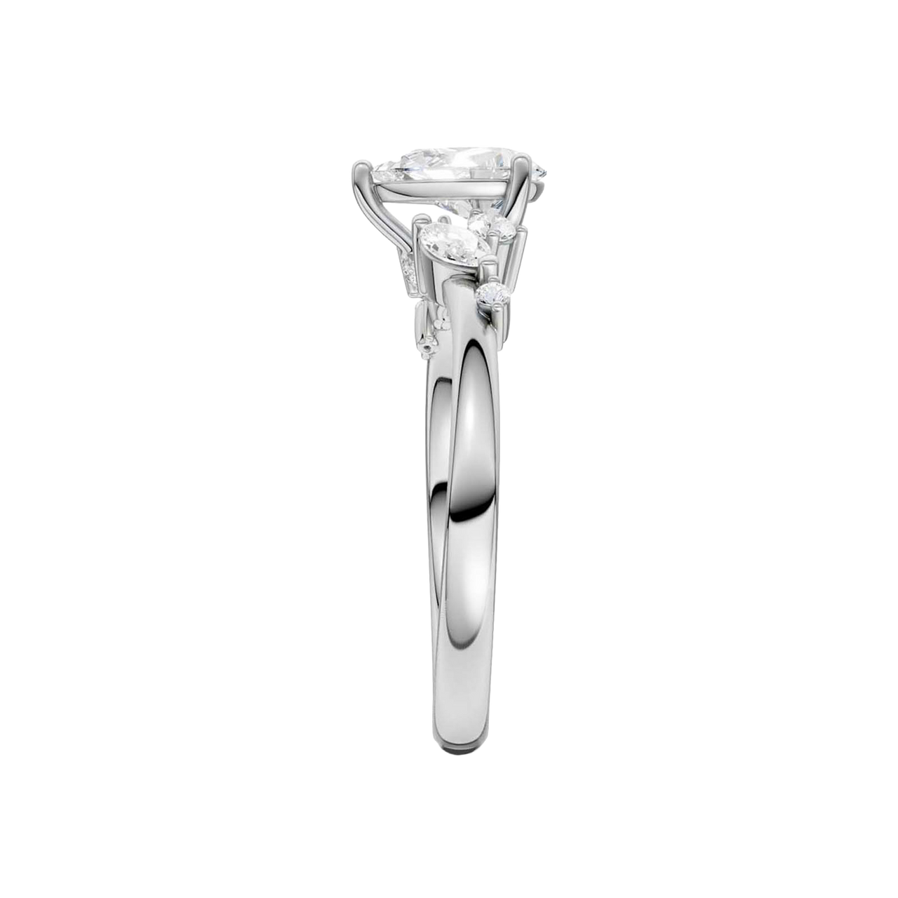 A side-profile view of a 14K white gold ring, showing the graceful setting of the three gems.