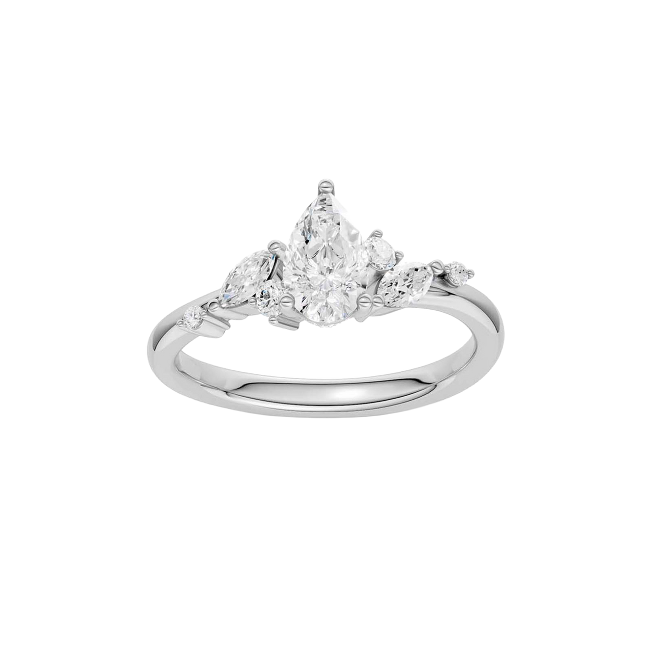 A top-down view of a 14K white gold ring with a three-stone cluster of round and pear-shaped gems.