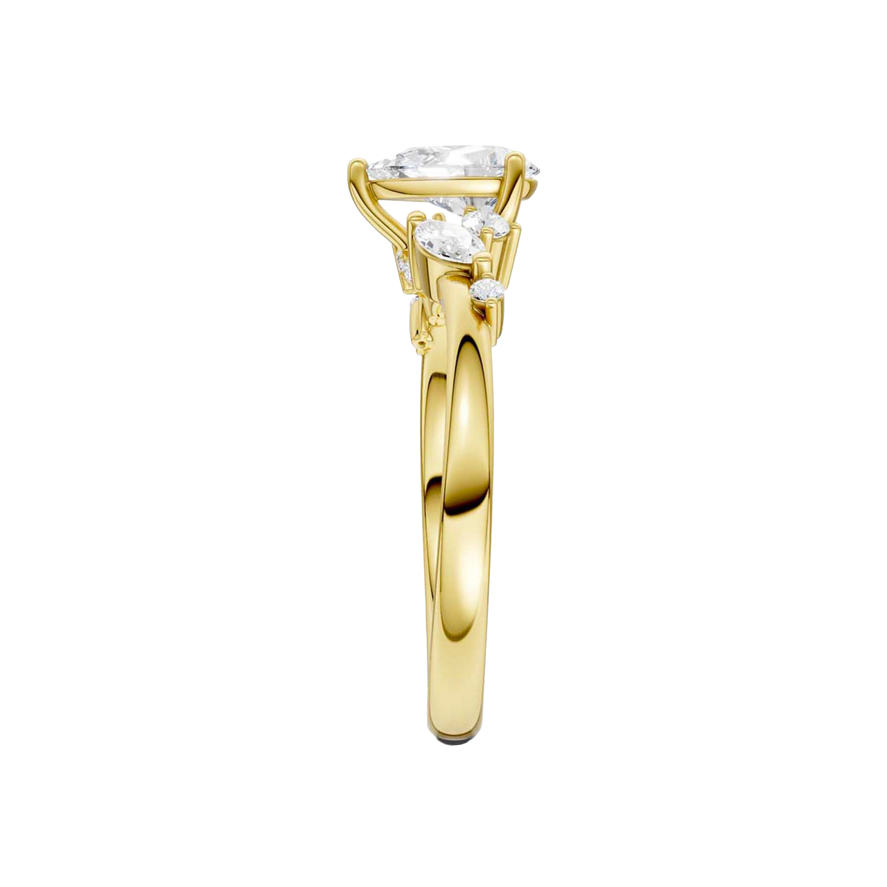 A side-profile view of a 14K yellow gold ring, showing the graceful setting of the three gems.