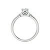 Front view of a 14K white gold ring featuring a round center gemstone with two smaller round stones on each side.
