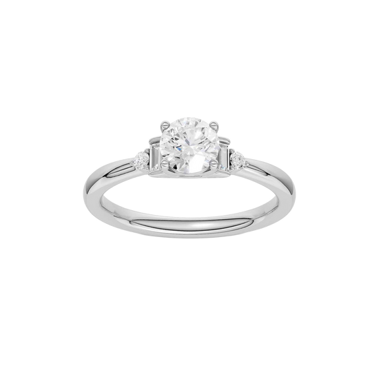 A top-down view of a 14K white gold ring with a central round jewel and two smaller round gems on the sides.