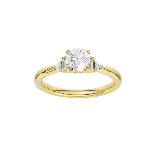 A top-down view of a 14K yellow gold ring with a central round jewel and two smaller round gems on the sides.