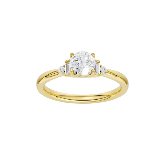 A top-down view of a 14K yellow gold ring with a central round jewel and two smaller round gems on the sides.