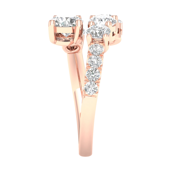 Side view of a rose gold bypass ring demonstrating the unique "floating" architecture of the diamond clusters. The image shows the polished interior of the 14K gold shank and the precision pavé detailing along the shoulder.