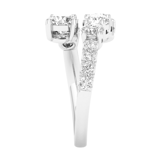 Side view of a white gold bypass ring demonstrating the unique "floating" architecture of the diamond clusters. The image shows the polished interior of the 14K gold shank and the precision pavé detailing along the shoulder.