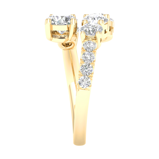 Side view of a yellow gold bypass ring demonstrating the unique "floating" architecture of the diamond clusters. The image shows the polished interior of the 14K gold shank and the precision pavé detailing along the shoulder.