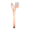 A side-profile view of a 14K rose gold open-shank ring, showing the fluid spiral and bezel-set diamonds.