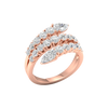 An angled view of a 14K rose gold open-shank ring, showcasing the brilliant pavé spiral.