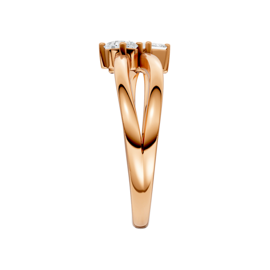 A side-profile view of a 14K rose gold bypass ring, showing the fluid band and the three baguette diamonds.