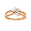A top-down view of a 14K rose gold bypass ring with a central cluster of three horizontal baguette diamonds.