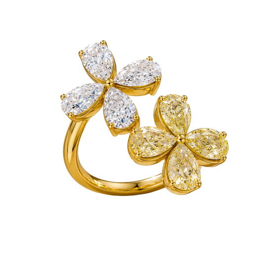 Angled view of a yellow gold floral diamond ring highlighting the dimensional flower motif, marquise-cut diamond sparkle, and high-polish gold finish.