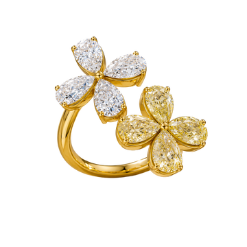 Angled view of a yellow gold floral diamond ring highlighting the dimensional flower motif, marquise-cut diamond sparkle, and high-polish gold finish.